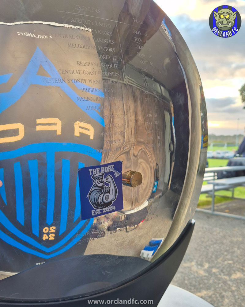 Who put The Port sticker on the back of the A-League Premiers' Plate?