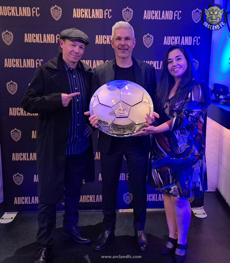 Rob and Ange from Orcland FC with Head Coach Steve Corica from Auckland FC holding the A-League Premiers' Plate at the Auckland FC Players' Awards 24/25