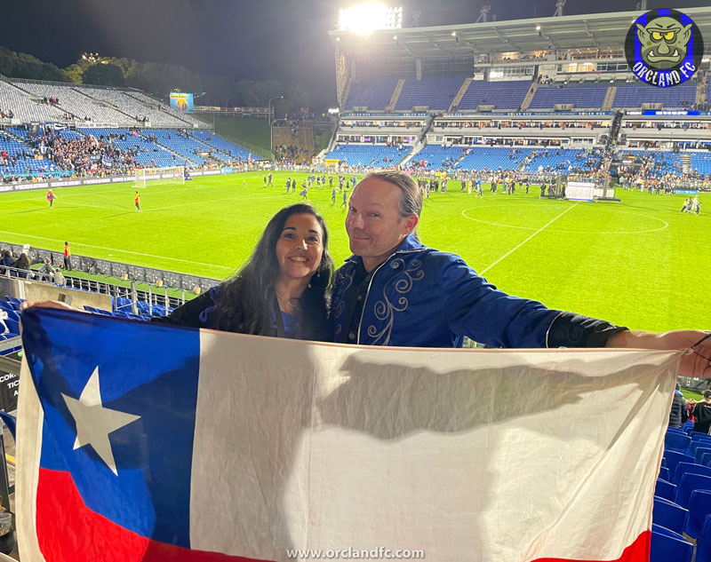Ange and Rob with the Chilean Flag at Go Media Stadium for Auckland FC's premiership ceremony - Orcland FC
