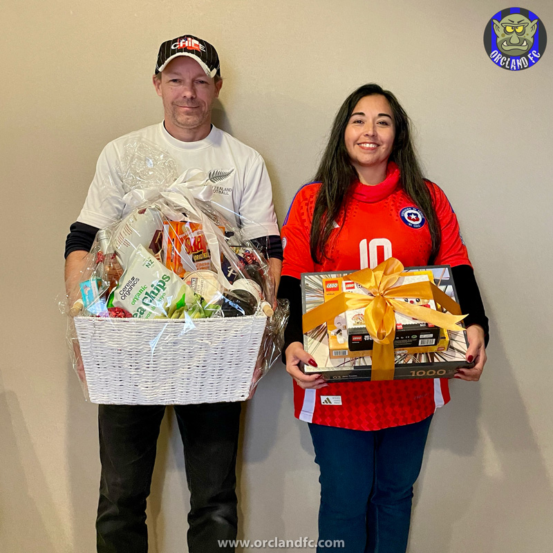 Rob and Ange with their raffle prizes | Battle of the Boots 2025 - MS Auckland | Orcland FC