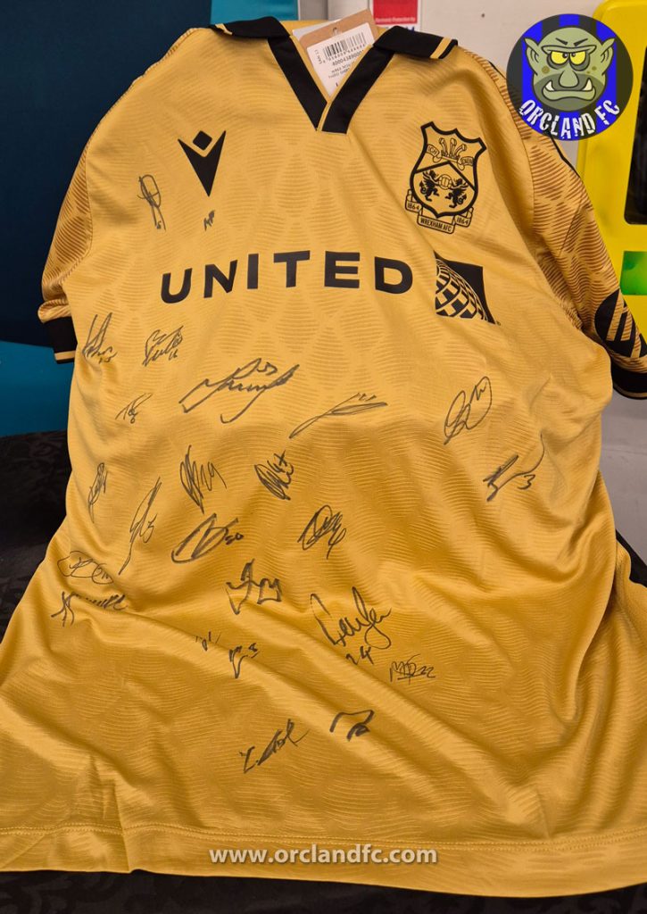 Signed Wrexham Football Shirt for auction at the Battle of the Boots 2025 - MS Auckland | Orcland FC