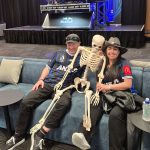 Rob and Ange (Orcland FC) with a skeleton at the Auckland FC Black Knight Club (with a DJ in the background)